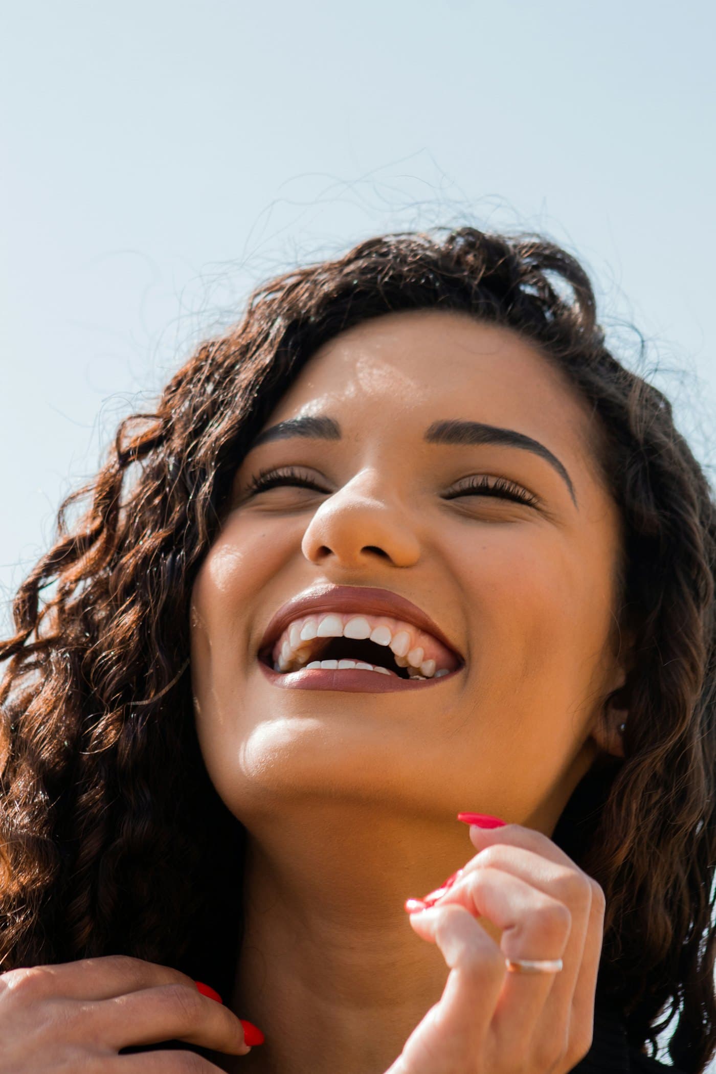 A patient smiling after cosmetic dental treatment